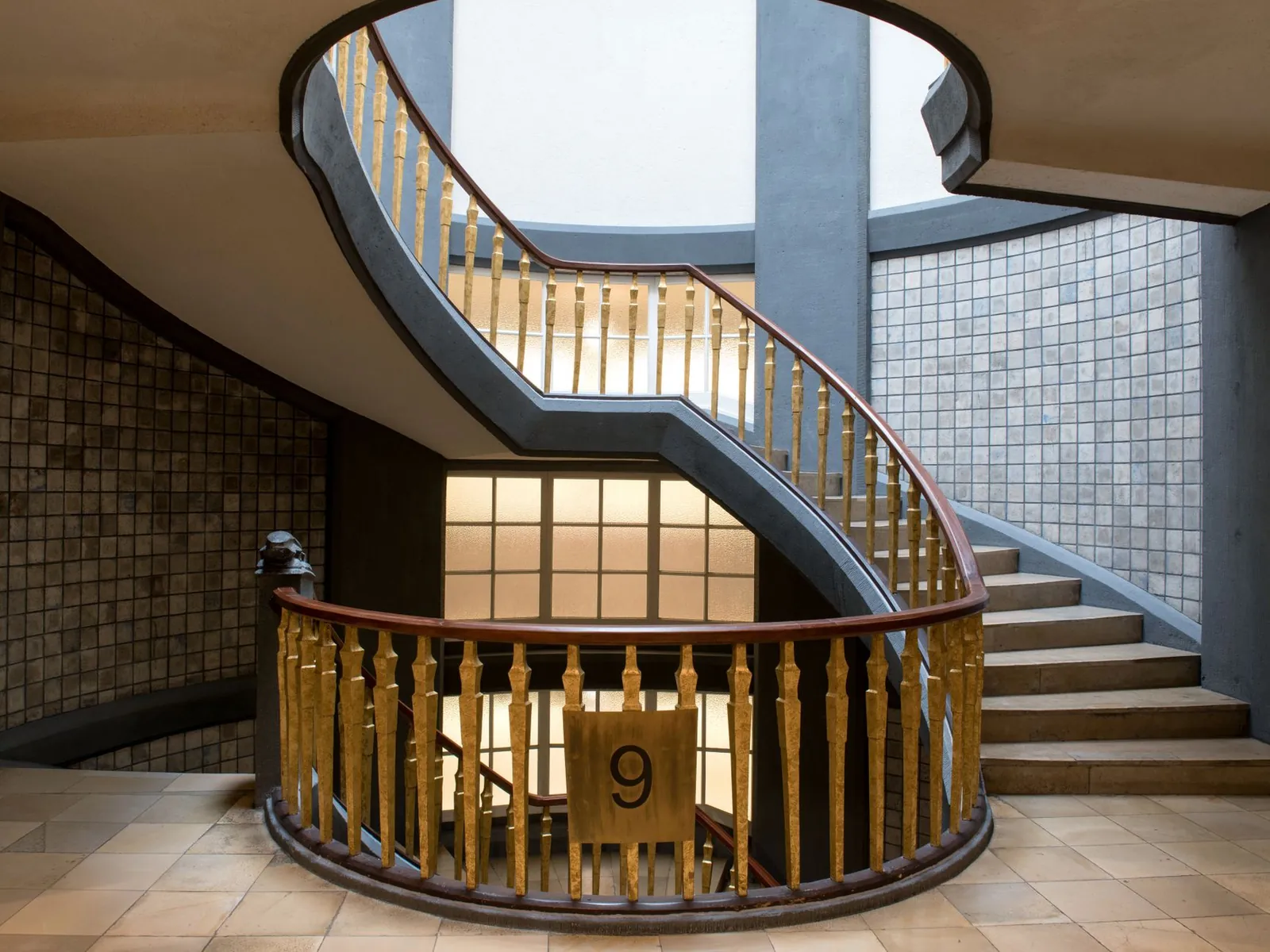 Interior of a sophisticated building in Hamburg featuring a spiral staircase.