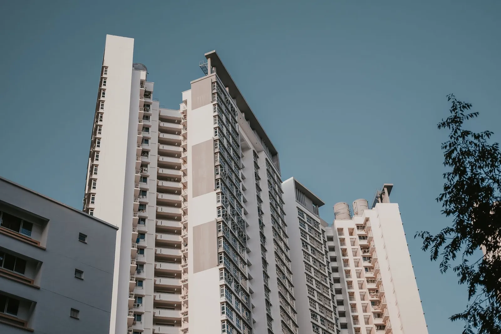 Low angle view of high-rise residential towers against a clear sky