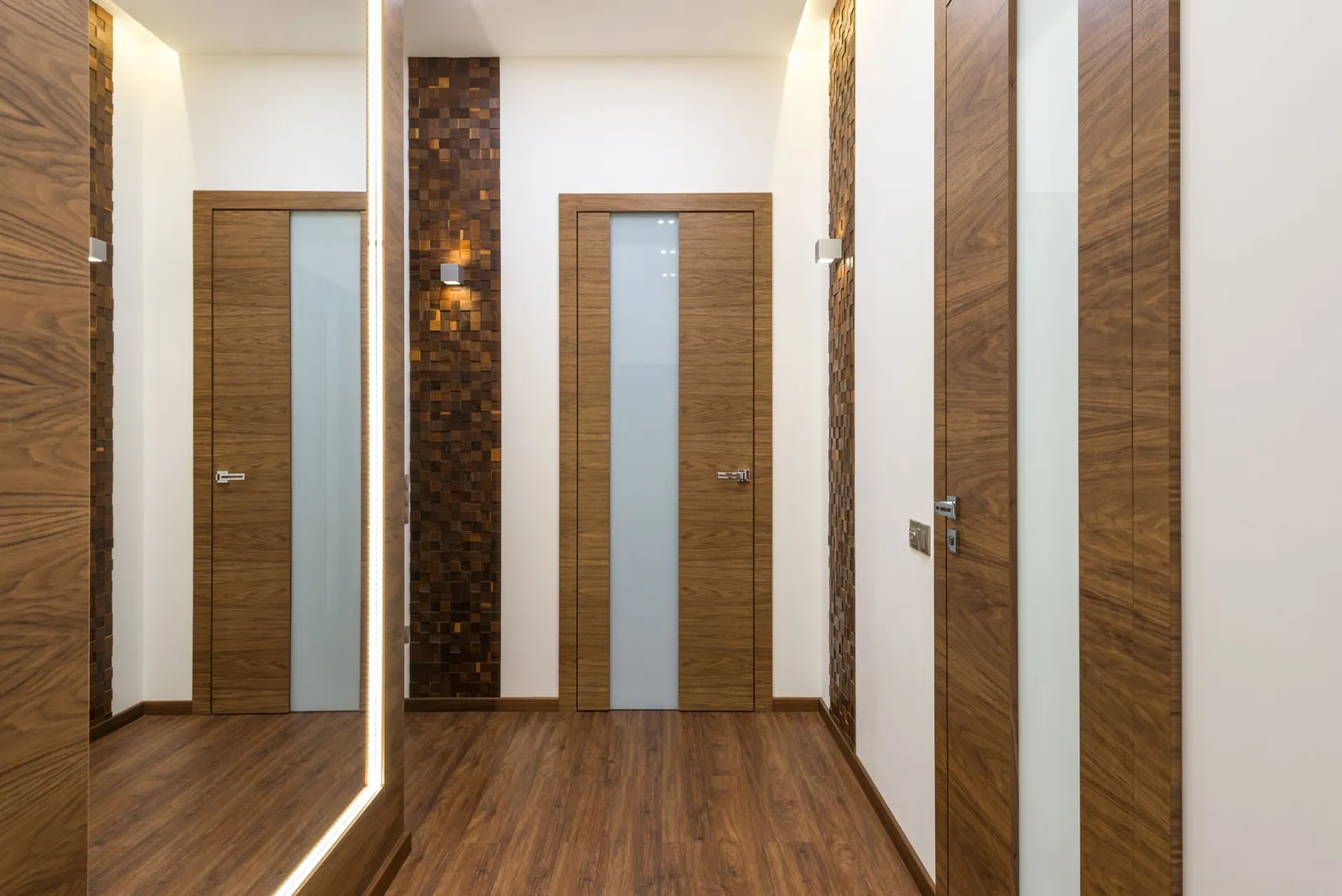 Internal hallway with several closed wooden doors
