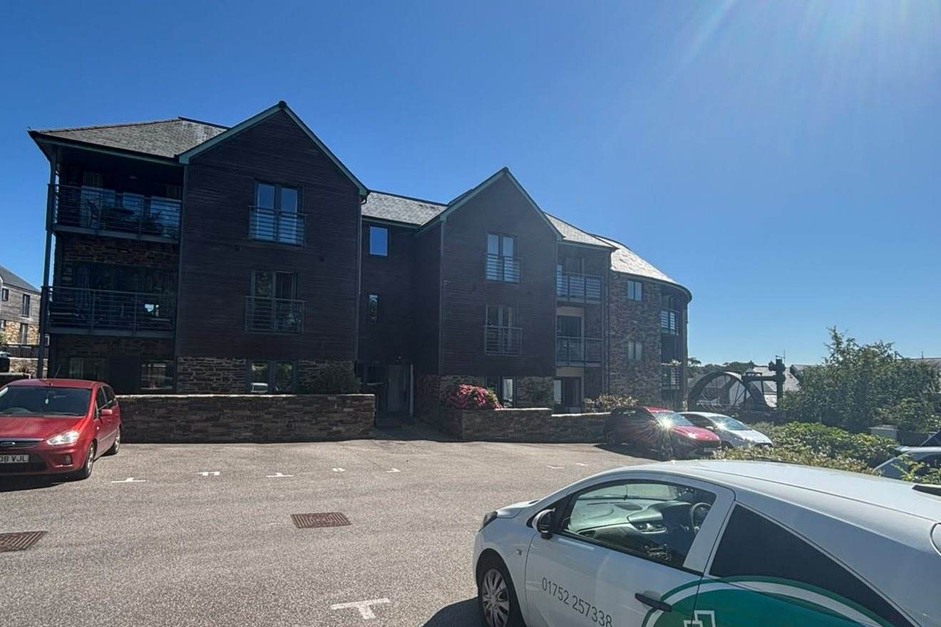 A timber-clad residential block under management
